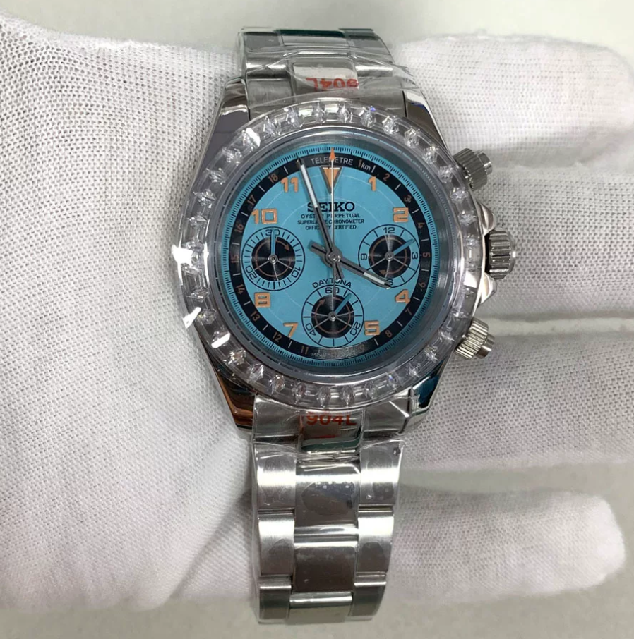 Daytona Ice Blue — Crystal-set bezel, ice blue Arabic chronograph dial